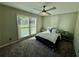 Comfortable bedroom with a ceiling fan and natural light at 2610 Stokesley Way, Snellville, GA 30078