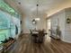 Bright dining room with wood floors, modern lighting, a large window and decorative trim at 2610 Stokesley Way, Snellville, GA 30078