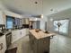 Modern kitchen with stainless steel appliances, granite counters, a kitchen island and eat-in area at 2610 Stokesley Way, Snellville, GA 30078