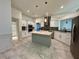 Bright kitchen features granite counters, stainless appliances, and a central island at 2610 Stokesley Way, Snellville, GA 30078