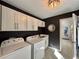 Well-organized laundry room with modern appliances and ample storage at 2610 Stokesley Way, Snellville, GA 30078