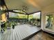 Relaxing screened porch with a ceiling fan and decorative plants at 2610 Stokesley Way, Snellville, GA 30078