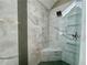 Modern shower with grey stone tiling, a glass enclosure, and a built in seat at 2610 Stokesley Way, Snellville, GA 30078