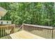 Wooden deck overlooking a private backyard with mature trees at 4840 Chapel Hill Rd, Douglasville, GA 30135