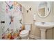 Stylish bathroom features a pedestal sink, decorative shower curtain at 4840 Chapel Hill Rd, Douglasville, GA 30135