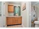 Convenient bathroom design featuring wood cabinets, countertop and fixtures at 4840 Chapel Hill Rd, Douglasville, GA 30135