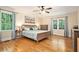 Spacious bedroom with hardwood floors, large windows, and neutral paint at 4840 Chapel Hill Rd, Douglasville, GA 30135