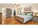 Bedroom featuring hardwood floors, a ceiling fan, and access to a walk-in closet at 4840 Chapel Hill Rd, Douglasville, GA 30135