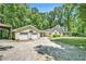 Detached garage and covered parking area with basketball hoop beside the home at 4840 Chapel Hill Rd, Douglasville, GA 30135