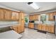 Spacious kitchen with wood cabinets, tile floors and stainless steel dishwasher at 4840 Chapel Hill Rd, Douglasville, GA 30135