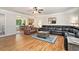 Open living room with hardwood floors, view of kitchen and a comfortable seating area at 4840 Chapel Hill Rd, Douglasville, GA 30135