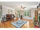 Spacious living room with hardwood floors, fireplace, staircase, and lots of natural light at 4840 Chapel Hill Rd, Douglasville, GA 30135