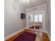 Cozy bedroom featuring hardwood floors, a closet with mirrored doors, and a wall-mounted television at 733 Frederica Ne St # 17, Atlanta, GA 30306