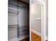 A view of an organized closet with metal shelving and sliding mirror doors at 733 Frederica Ne St # 17, Atlanta, GA 30306