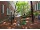 Landscaped courtyard featuring walking path between brick buildings at 733 Frederica Ne St # 17, Atlanta, GA 30306