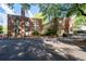 Brick apartment building featuring mature trees at 733 Frederica Ne St # 17, Atlanta, GA 30306