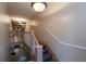 Hallway stairway with carpeted stairs, leading to apartments on the upper level with neutral paint and bright lighting at 733 Frederica Ne St # 17, Atlanta, GA 30306