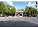 Bustling street view featuring mature trees, multiple businesses and several parked cars at 733 Frederica Ne St # 17, Atlanta, GA 30306
