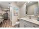 Bathroom featuring updated vanity with white cabinets and quartz countertops at 771 Phil Haven Ln, Kennesaw, GA 30152