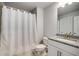 Neutral bathroom featuring a sink and vanity with white shaker cabinets and a white shower curtain at 771 Phil Haven Ln, Kennesaw, GA 30152