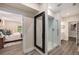 Spacious bathroom entrance with a framed mirror and shower with glass doors at 771 Phil Haven Ln, Kennesaw, GA 30152