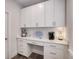 This butler's pantry features white cabinets, a countertop, and convenient storage at 771 Phil Haven Ln, Kennesaw, GA 30152