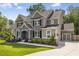 Beautiful two-story home showcasing brick accents, a two-car garage, and a well-maintained lawn at 771 Phil Haven Ln, Kennesaw, GA 30152