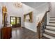 Grand foyer featuring hardwood floors, a staircase, and large windows, providing a bright and welcoming entrance at 771 Phil Haven Ln, Kennesaw, GA 30152