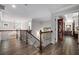 Hallway featuring dark wood floors and an ornate chandelier at 771 Phil Haven Ln, Kennesaw, GA 30152