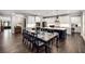 Open-concept kitchen with white cabinets, stainless steel appliances, and a large island, perfect for entertaining at 771 Phil Haven Ln, Kennesaw, GA 30152