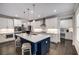 Spacious kitchen boasts an island, stainless appliances, pendant lighting, and ample cabinet space at 771 Phil Haven Ln, Kennesaw, GA 30152