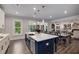 Spacious kitchen with a large island, white cabinets, and stainless steel appliances, ideal for cooking and gathering at 771 Phil Haven Ln, Kennesaw, GA 30152