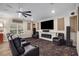 Home theater featuring reclining chairs, a large screen, and a fireplace at 771 Phil Haven Ln, Kennesaw, GA 30152
