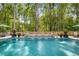 Refreshing in-ground pool with a decorative waterfall feature and ample space for outdoor seating at 771 Phil Haven Ln, Kennesaw, GA 30152