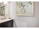Powder room with framed art and antique sink at 771 Phil Haven Ln, Kennesaw, GA 30152