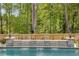 Close-up of the stone waterfall flowing into the backyard pool at 771 Phil Haven Ln, Kennesaw, GA 30152