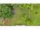 Aerial view of property showcasing lush backyard, mature trees, and a detached garage at 14 Connie St, Cartersville, GA 30121