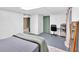 Spacious basement room with a desk, bed, and a large mirror at 14 Connie St, Cartersville, GA 30121