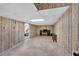 Large unfinished basement space with wood paneled walls and carpeted entrance at 14 Connie St, Cartersville, GA 30121
