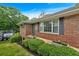 Close up of brick home featuring manicured bushes and a clean walkway at 14 Connie St, Cartersville, GA 30121