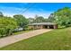 Beautiful brick home with long driveway, well-kept lawn, and covered carport at 14 Connie St, Cartersville, GA 30121