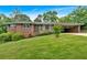 Charming brick home with a well-manicured lawn and covered carport at 14 Connie St, Cartersville, GA 30121