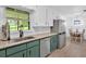 View of the kitchen and eat in dining with stainless steel appliances and modern countertops at 14 Connie St, Cartersville, GA 30121