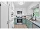 Bright kitchen featuring stainless steel appliances, custom cabinets, and granite countertops at 14 Connie St, Cartersville, GA 30121