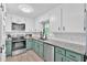 Updated kitchen with stainless steel appliances, subway tile backsplash, and granite countertops at 14 Connie St, Cartersville, GA 30121