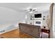 Cozy living room featuring a modern fireplace, mounted TV, and hardwood floors at 14 Connie St, Cartersville, GA 30121