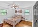 Serene bedroom featuring hardwood floors, neutral decor, and natural light from dual windows at 14 Connie St, Cartersville, GA 30121