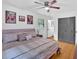 Large main bedroom with natural lighting, hardwood floors, and ceiling fan at 14 Connie St, Cartersville, GA 30121