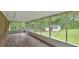 Large screened porch with view of lush backyard and detached garage, perfect for outdoor relaxation at 14 Connie St, Cartersville, GA 30121