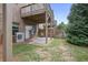 Backyard featuring a stone patio, privacy fence, green grass and treed perimeter at 1582 Cambridge Pl, Marietta, GA 30062